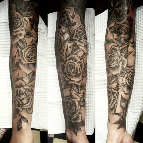 Finished and healed rose half sleeve on Harry.